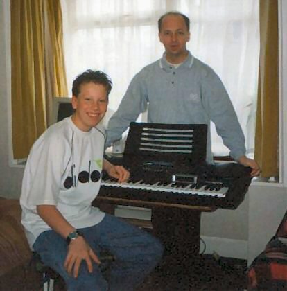 Andrew and a young student.